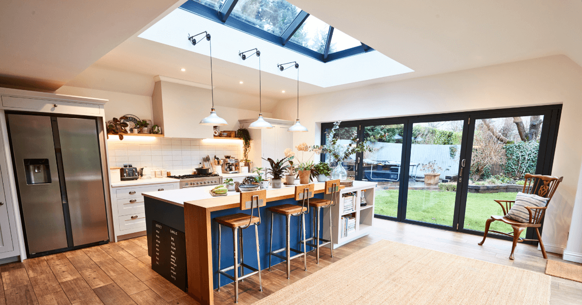 Modern kitchen with skylight and large windows