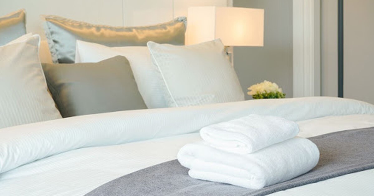 Guest Bedroom Design Idea with pillows and towels