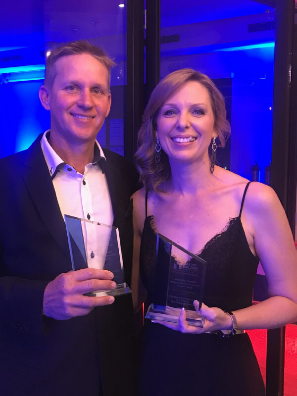 Bundaberg home builders Michael & Gillian Darr holding the Master Builders Regional Award.