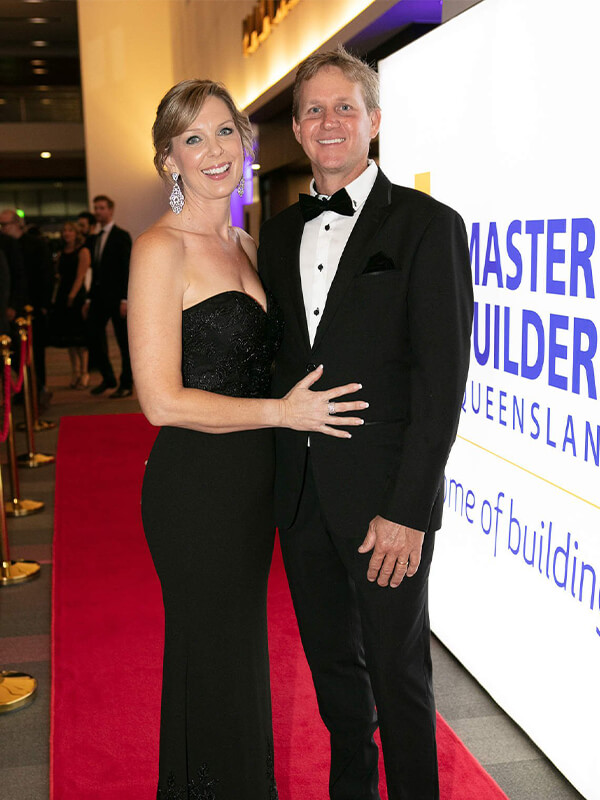 Bundaberg home builders Michael & Gillian Darr posing for camera on the red carpet at 2018 awards night