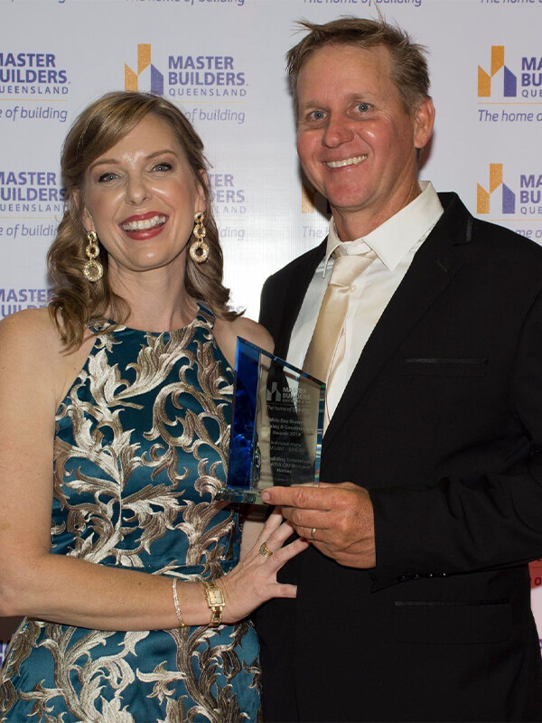Bundaberg home builders Michael & Gillian Darr receiving the 2019 Master Builders Regional Award
