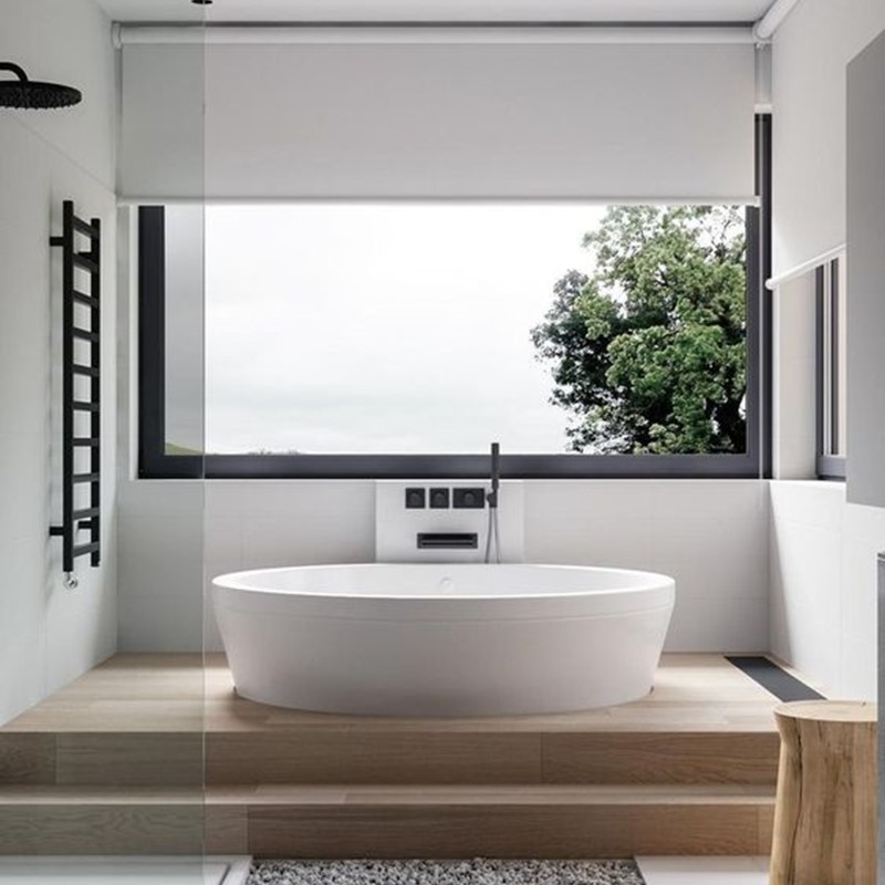Free-standing baths on its on level in bathroom