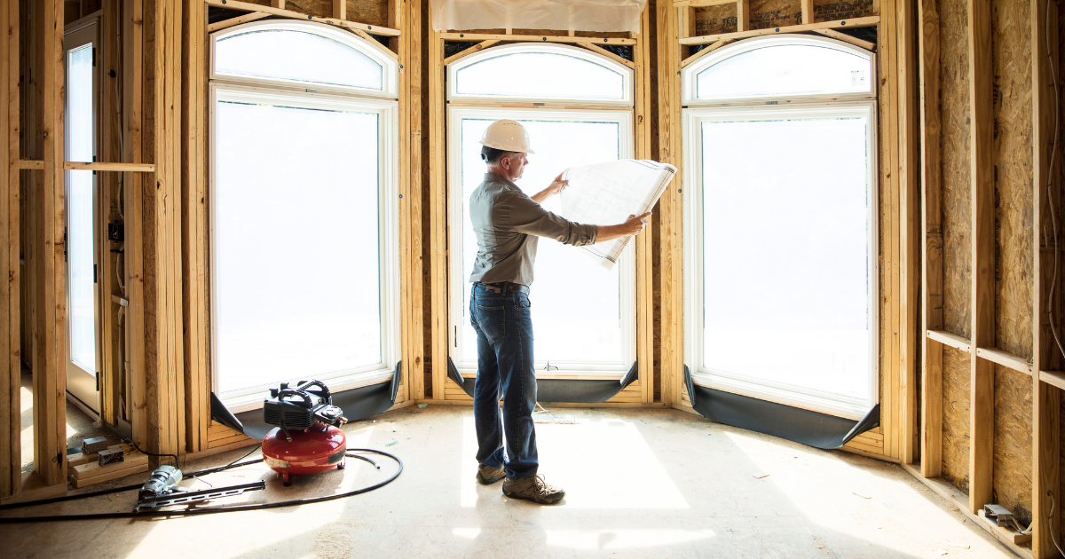 home builder looking at house planes