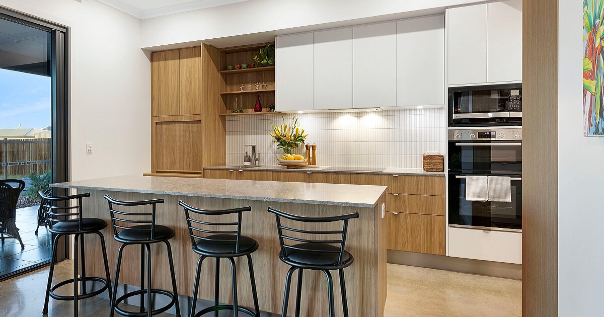 Modern white and timber kitchen with centre island and stools