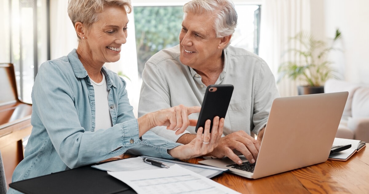 older couple looking at phone