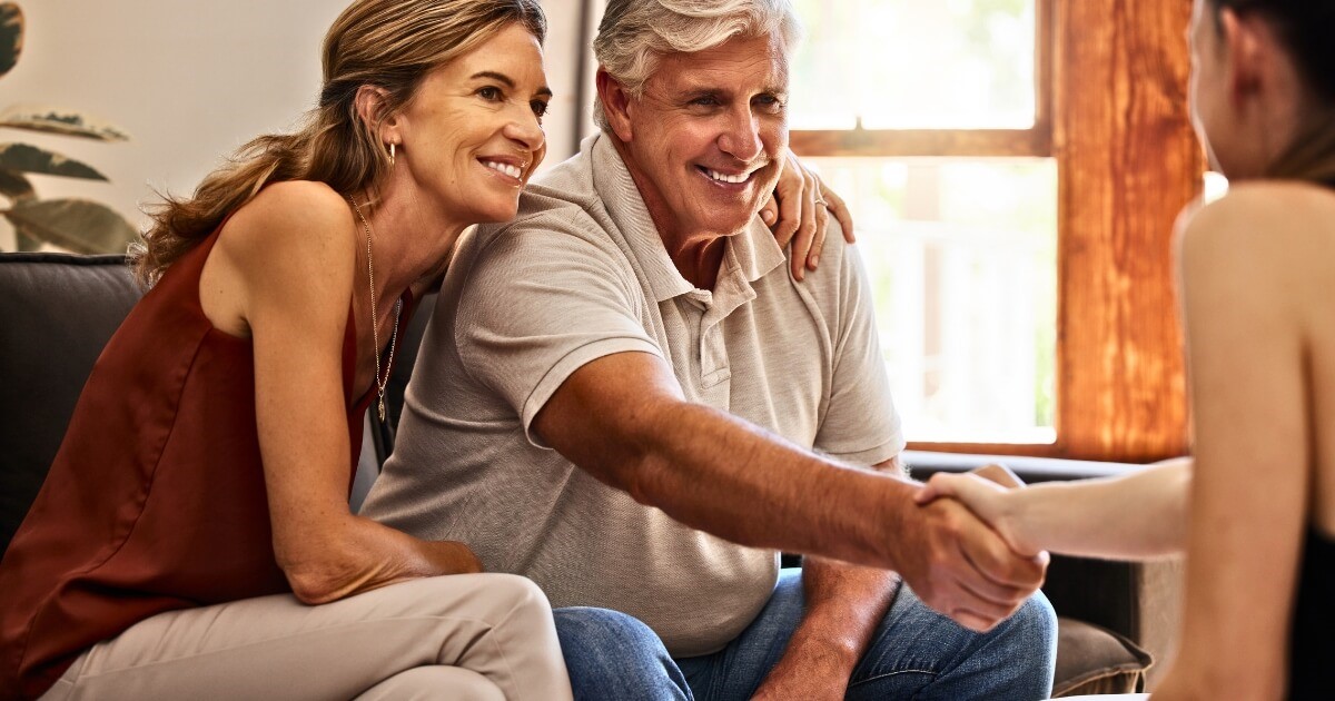 Happy couple getting house plans in Bundaberg