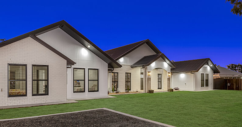 front aspect of home with double hung window design
