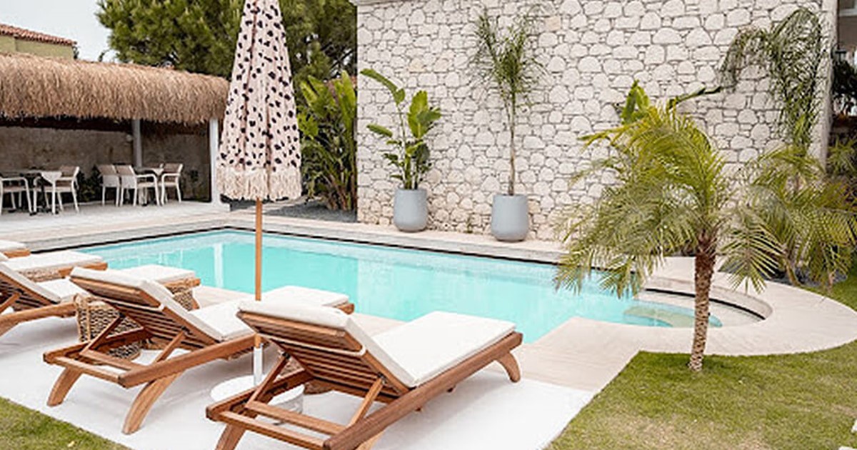 Beautiful pool cabana and deck chairs