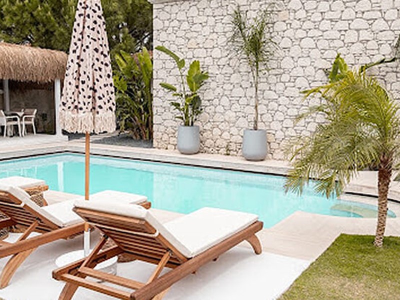 Beautiful pool cabana and deck chairs