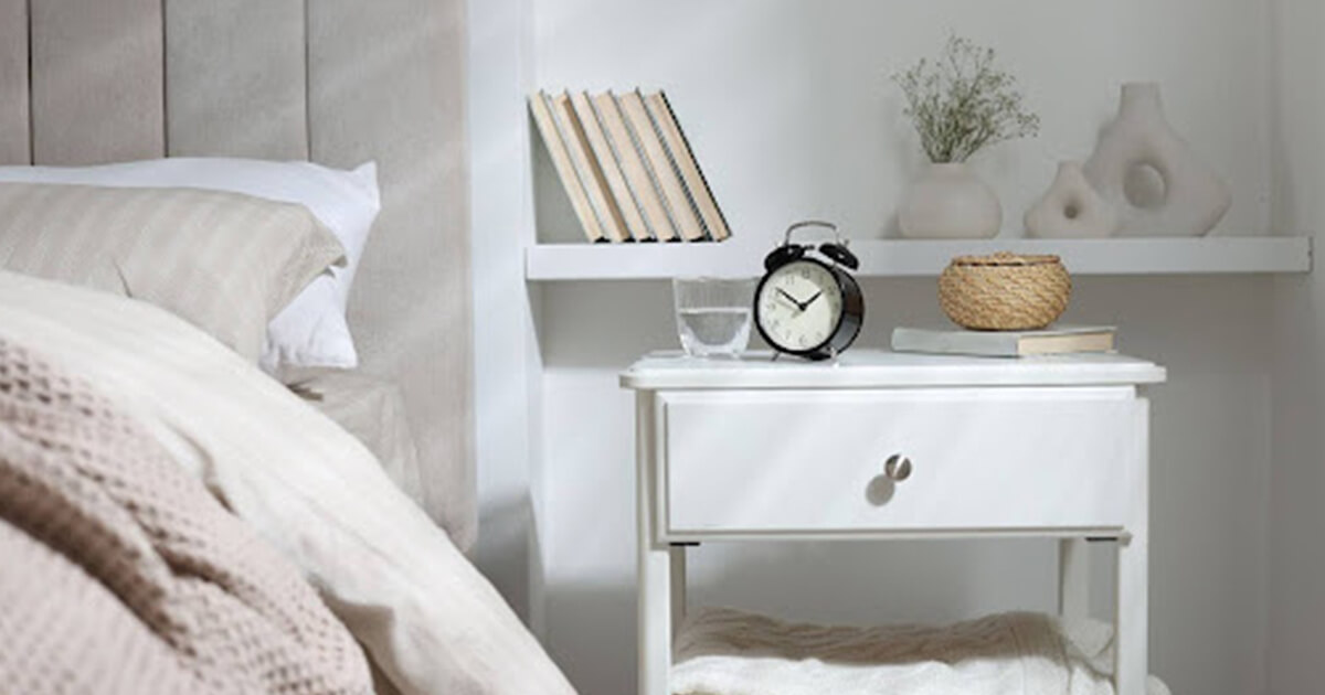 Small guest room design idea with bed, table clock