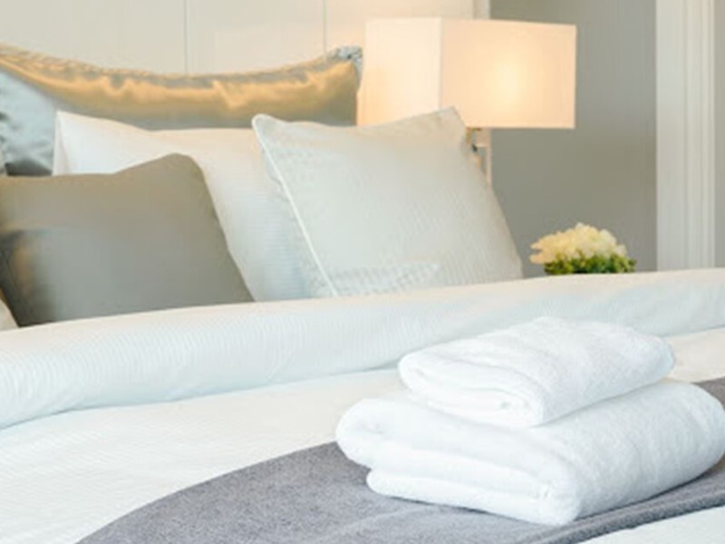 Guest Bedroom Design Idea with pillows and towels
