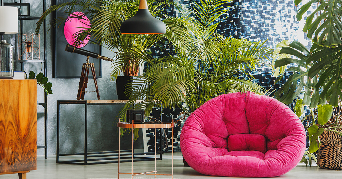Bright pink chair in 80s inspired room